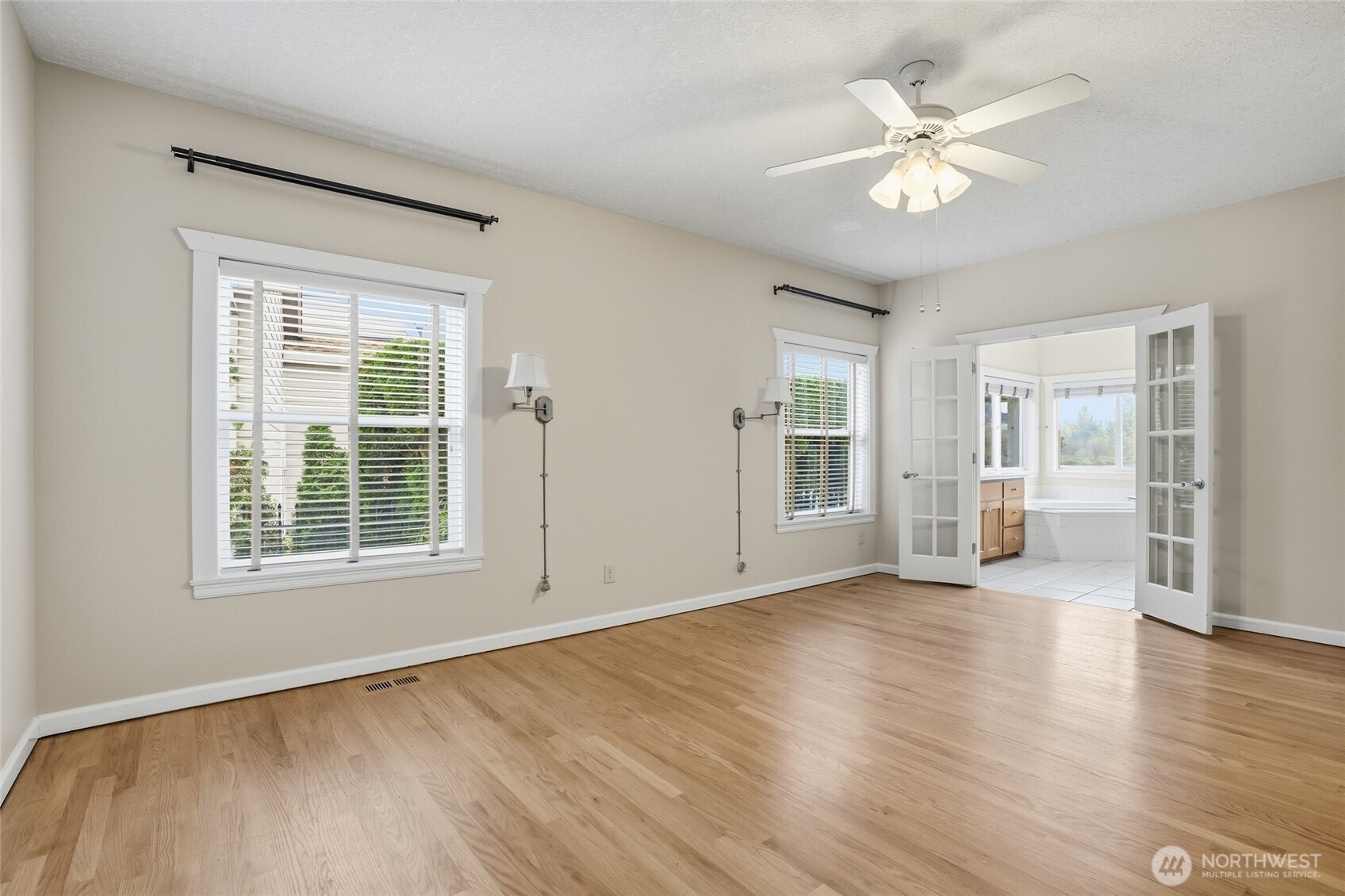3550 Northeast 214th Avenue Fairview, OR 97024 - Photo 18 of 40 a view of an empty room with a window and wooden floor