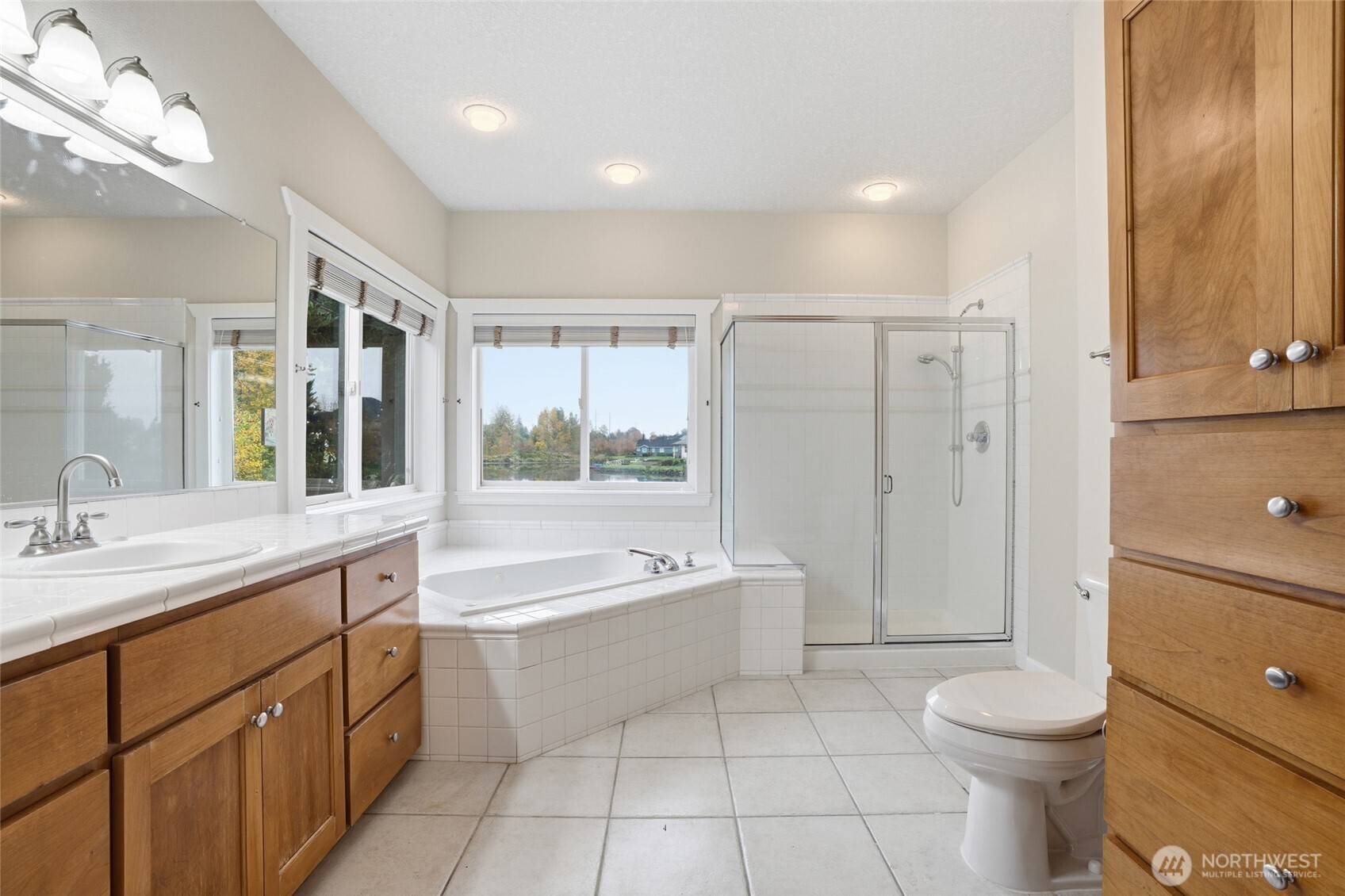 3550 Northeast 214th Avenue Fairview, OR 97024 - Photo 19 of 40 a bathroom with a granite countertop sink toilet mirror and bathtub