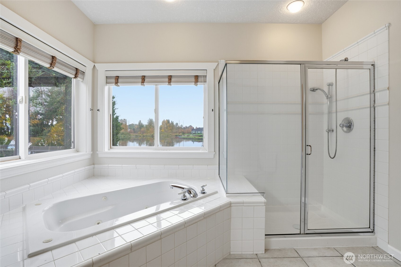 3550 Northeast 214th Avenue Fairview, OR 97024 - Photo 20 of 40 a bathroom with a granite countertop bathtub and a shower