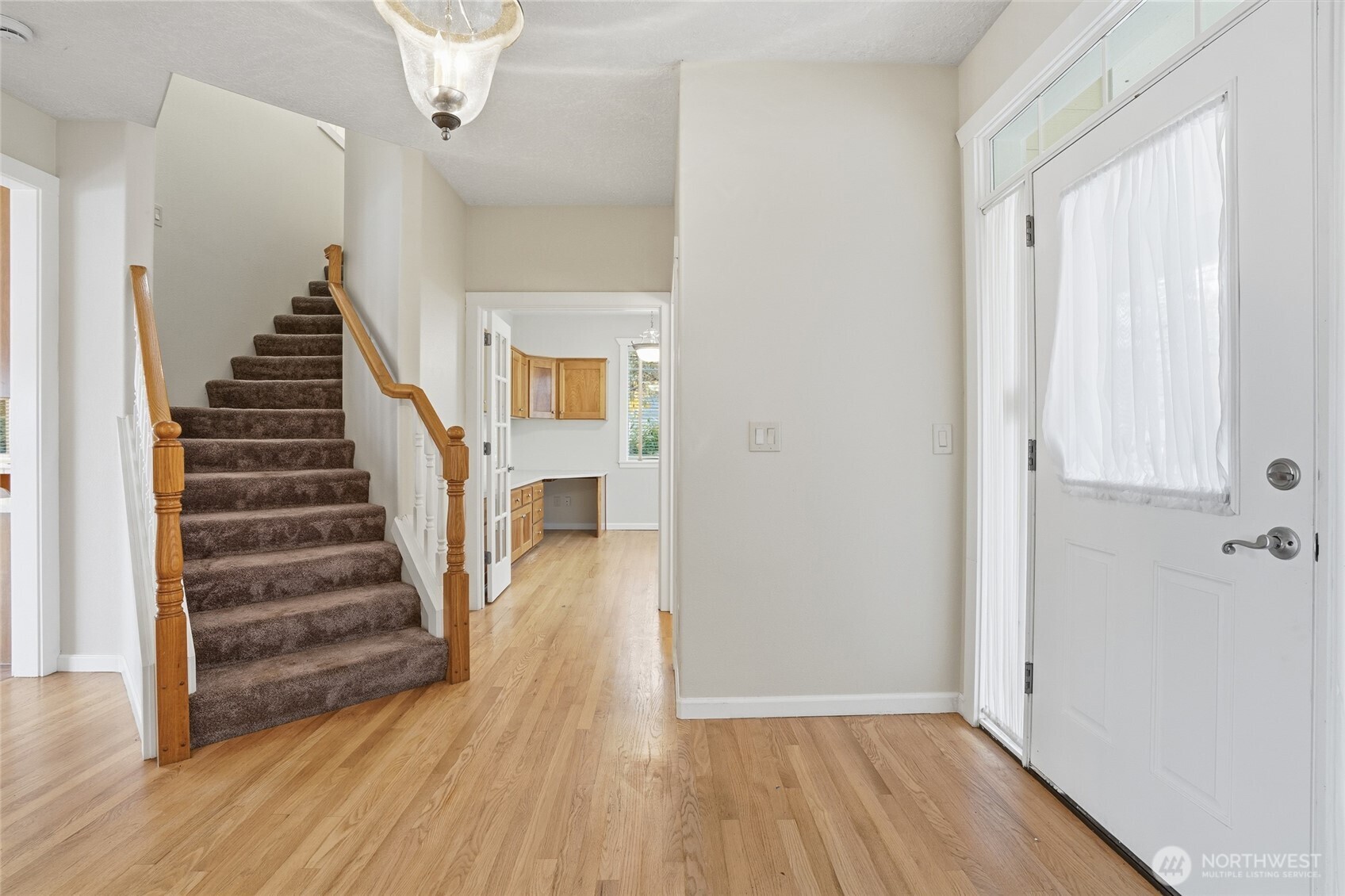 3550 Northeast 214th Avenue Fairview, OR 97024 - Photo 23 of 40 a view of a hallway with wooden floor and entryway