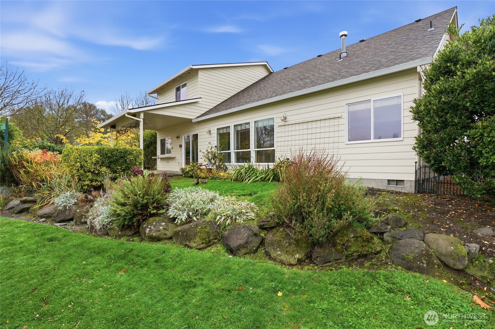3550 Northeast 214th Avenue Fairview, OR 97024 - Photo 31 of 40 a front view of a house with a garden