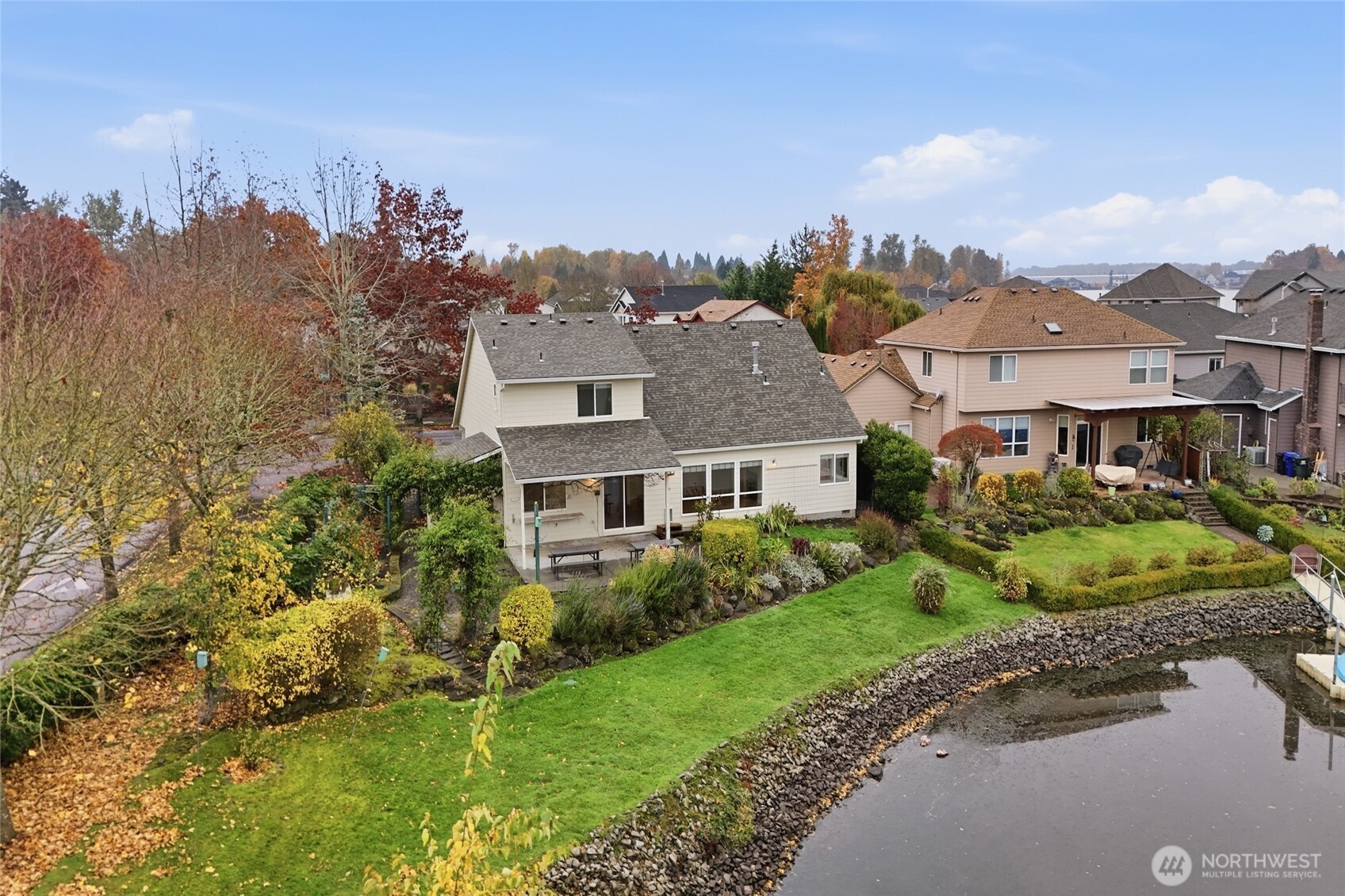 3550 Northeast 214th Avenue Fairview, OR 97024 - Photo 34 of 40 a view of a big house with a big yard and large trees