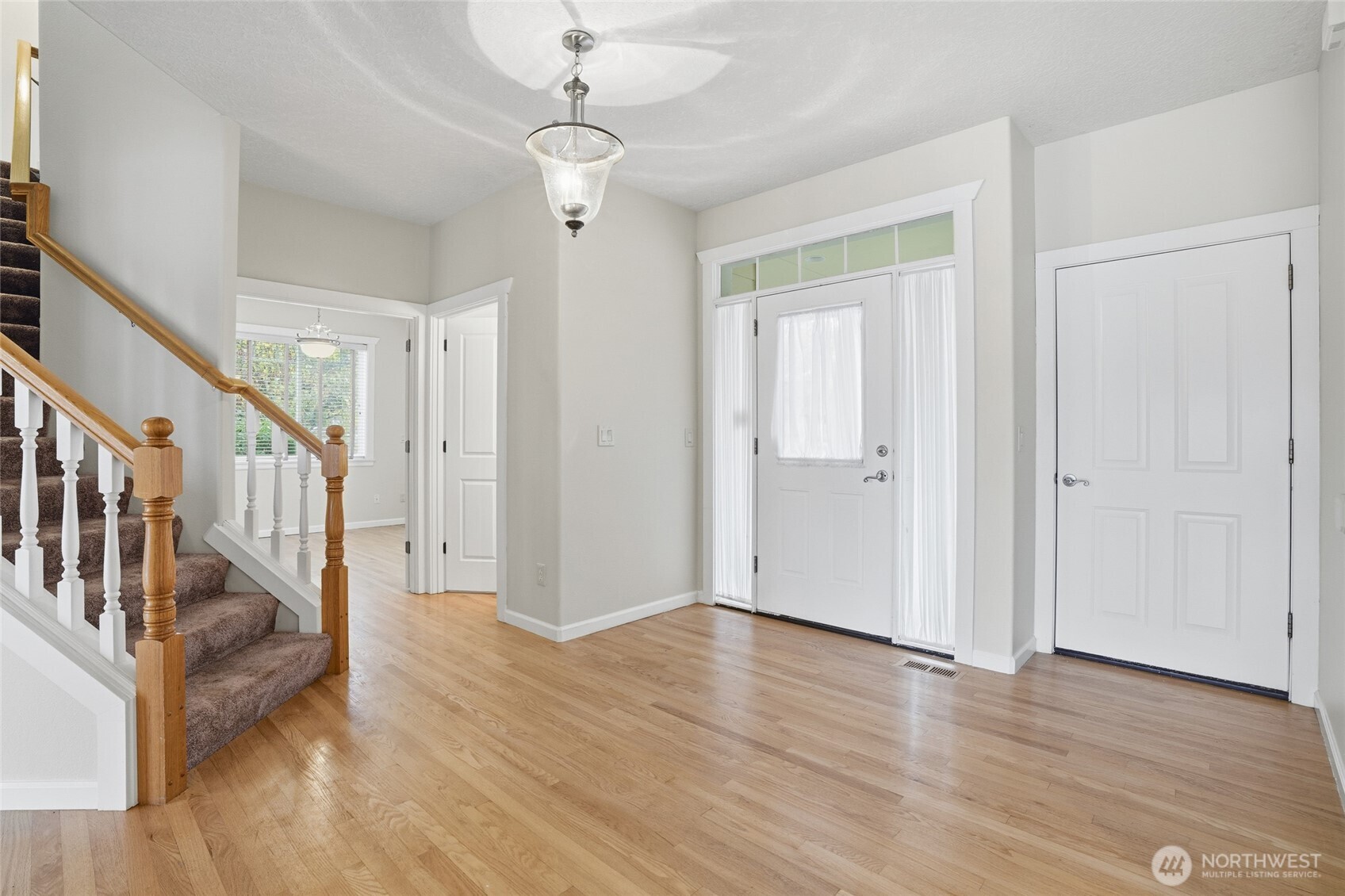 3550 Northeast 214th Avenue Fairview, OR 97024 - Photo 7 of 40 a view of an entryway with wooden floor and door