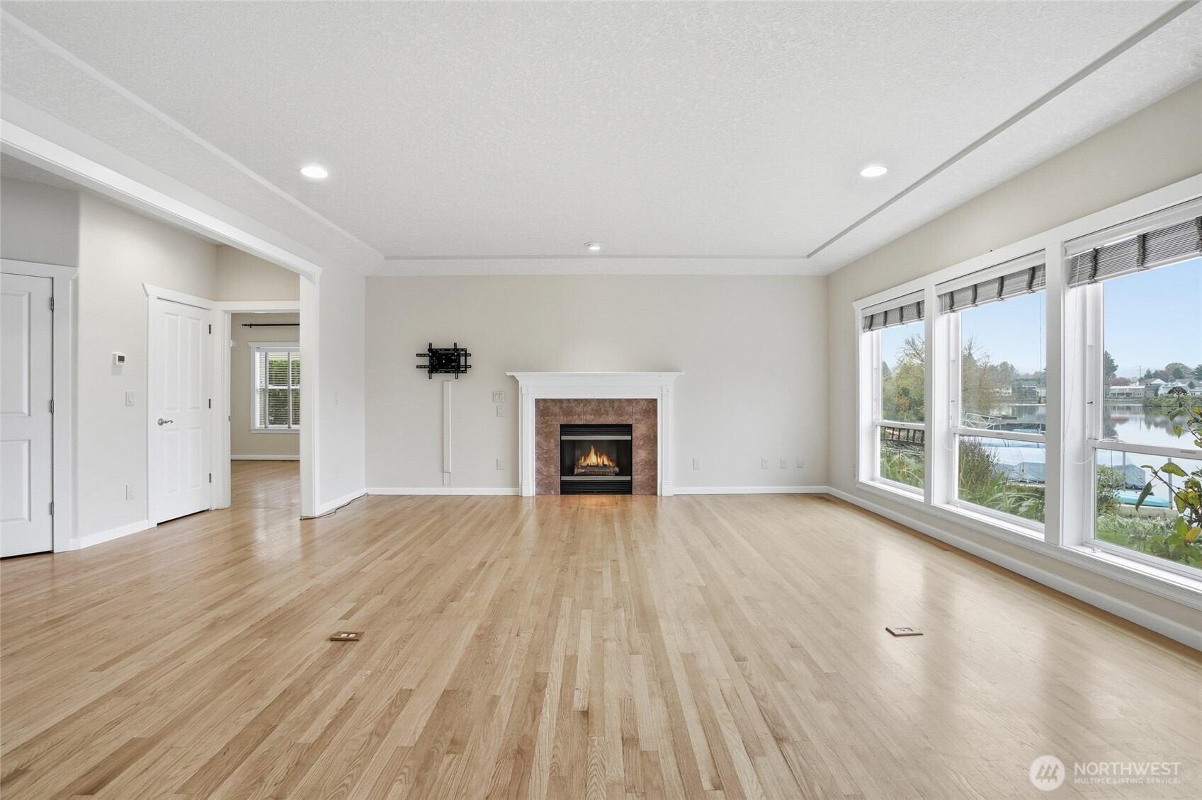 3550 Northeast 214th Avenue Fairview, OR 97024 - Photo 9 of 40 a view of an empty room with wooden floor and a window