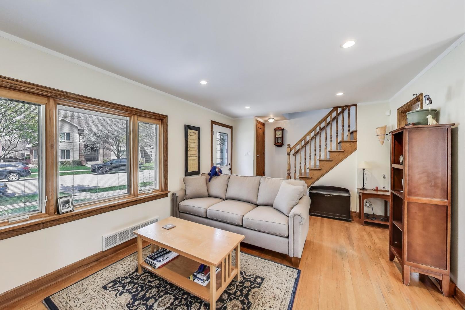 7837 East Prairie Road Skokie, IL 60076 - Photo 5 of 31 a living room with furniture and a wooden floor