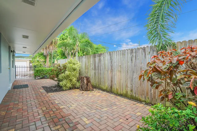 a view of a backyard with potted plants