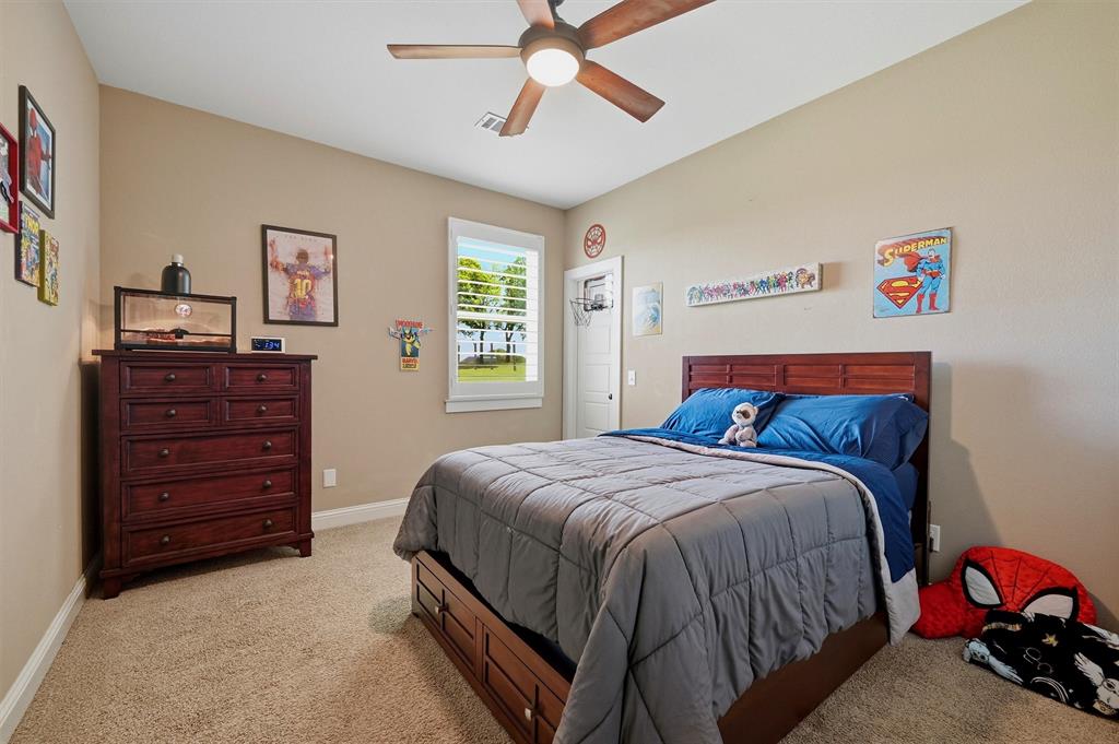 662 Preakness Place Road Van Alstyne, TX 75495 - Photo 25 of 39 a bedroom with a bed and a dresser