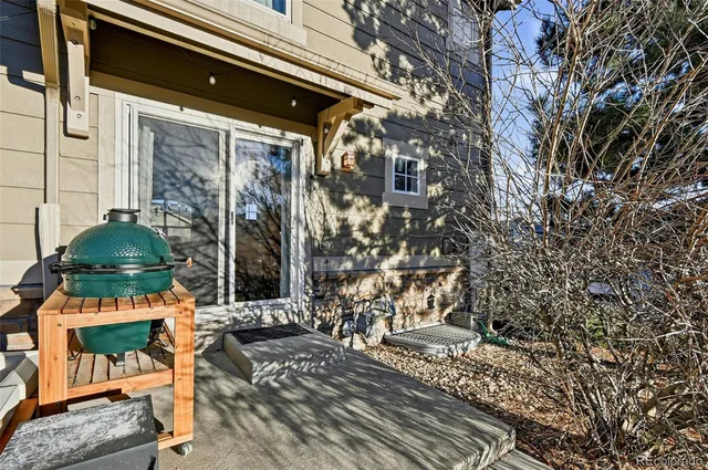 a front view of a house with outdoor seating