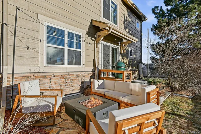 a view of a balcony with couches and wooden floor