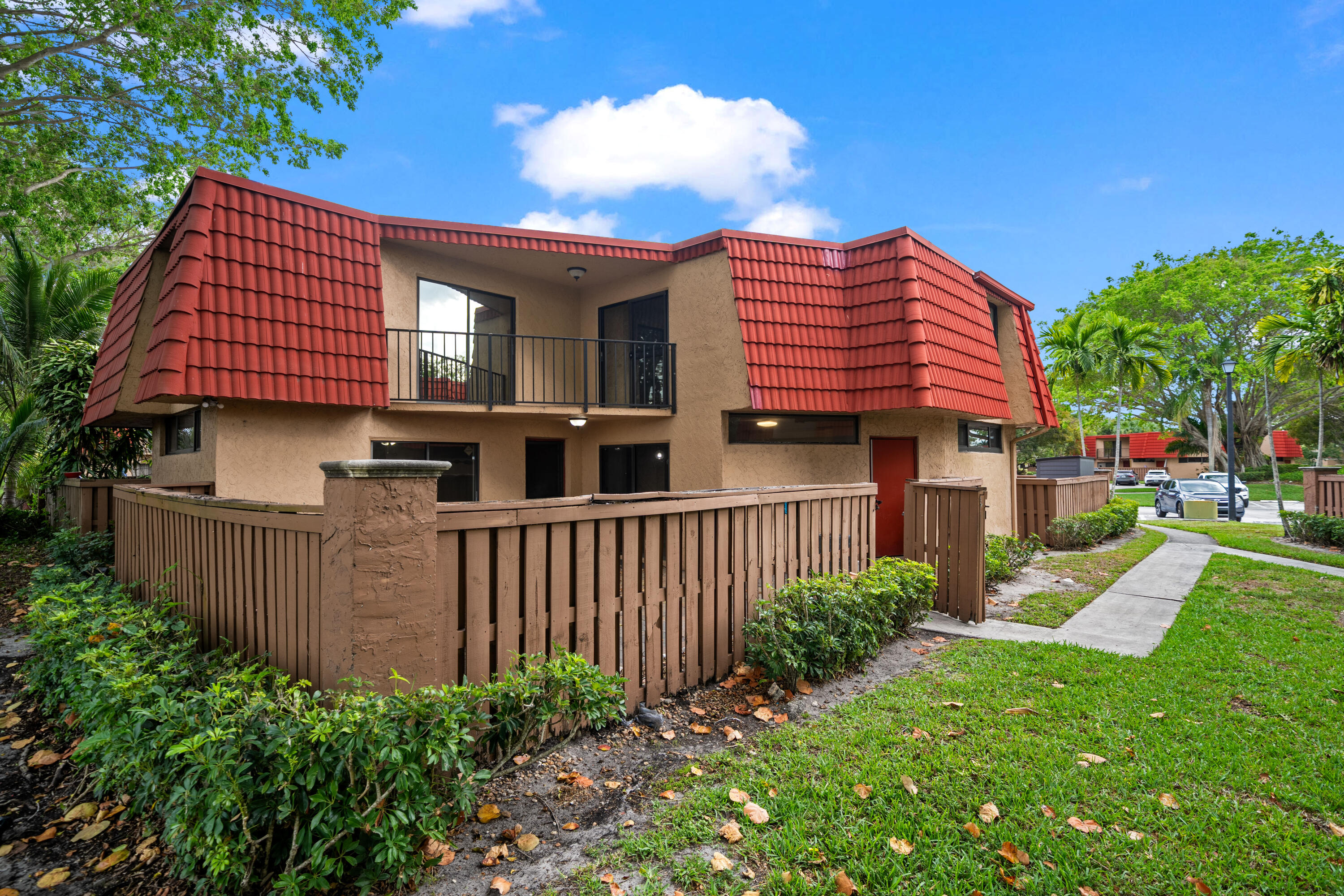 8237 Severn Drive, Unit A Boca Raton, FL 33433 - Photo 1 of 19 a front view of a house with garden