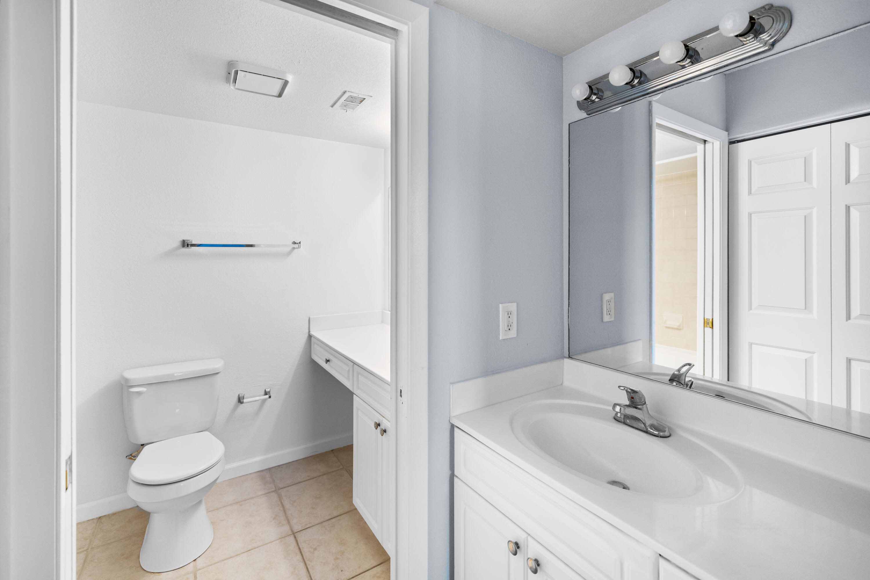 8237 Severn Drive, Unit A Boca Raton, FL 33433 - Photo 18 of 19 a bathroom with a sink a toilet and shower