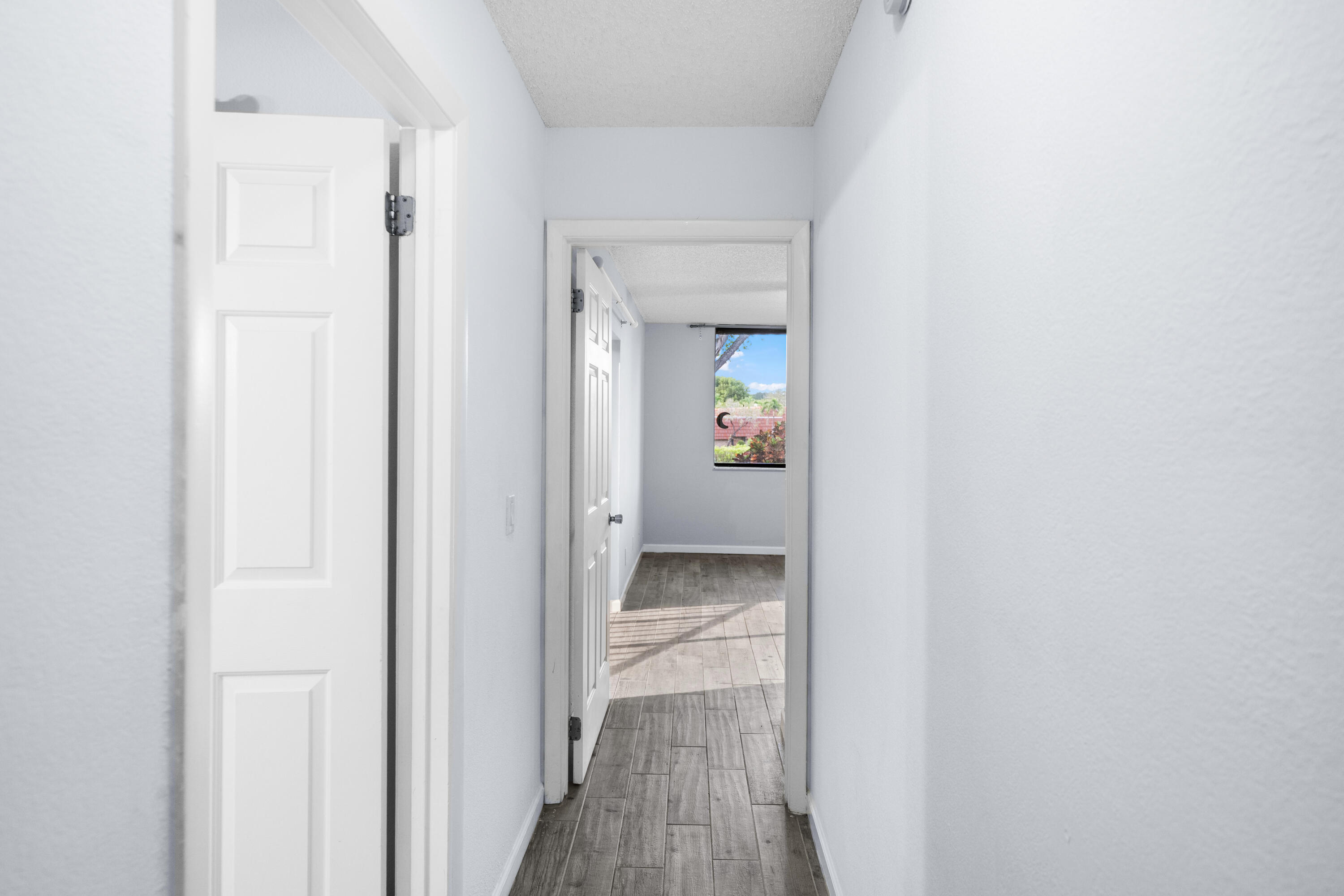 8237 Severn Drive, Unit A Boca Raton, FL 33433 - Photo 10 of 19 a view of a bathroom from the hallway