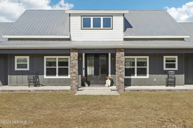 a front view of a house with a patio