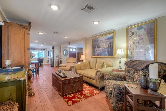 a living room with furniture fireplace and a window
