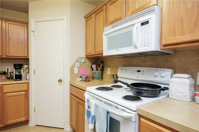a kitchen with a stove and a microwave