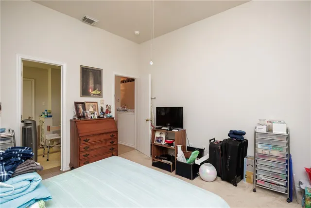 a bedroom with a bed and a television in it