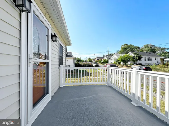 a view of an empty room with windows