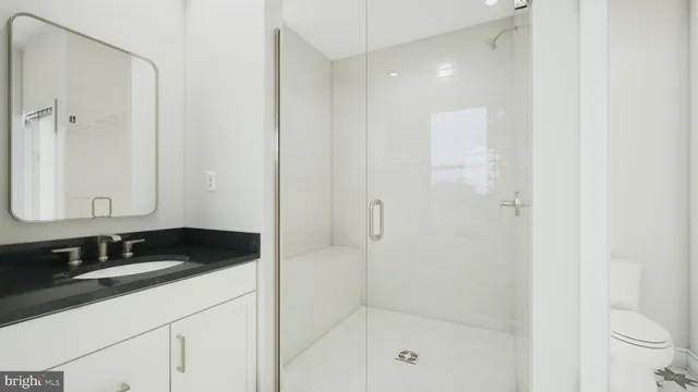 a bathroom with a sink and a shower