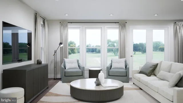 a living room with couch and a large window