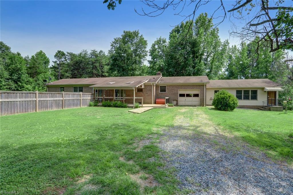 3389 Wayne White Road Climax, NC 27233 - Photo 20 of 30 Back view of house, 1 car garage, apartment to the right