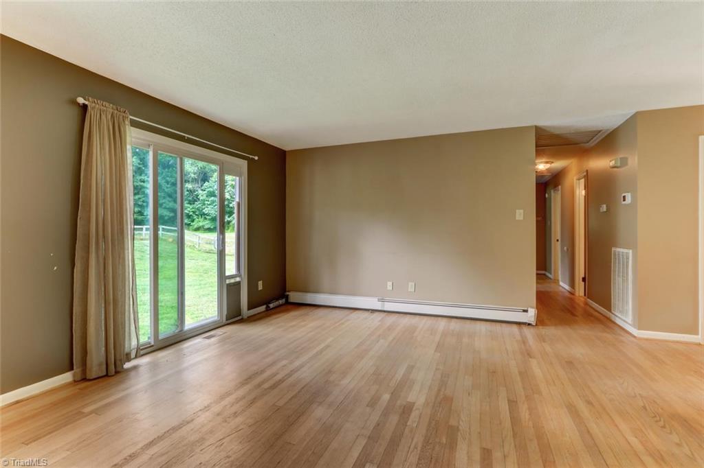 3389 Wayne White Road Climax, NC 27233 - Photo 3 of 30 Open Living room overlooking back yard, hallway back to bedroom