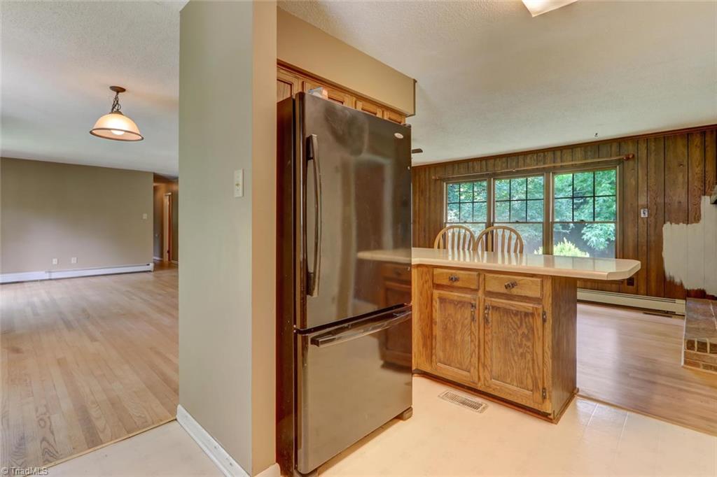 3389 Wayne White Road Climax, NC 27233 - Photo 7 of 30 Double bar stool island from Den and entrance to dining room.