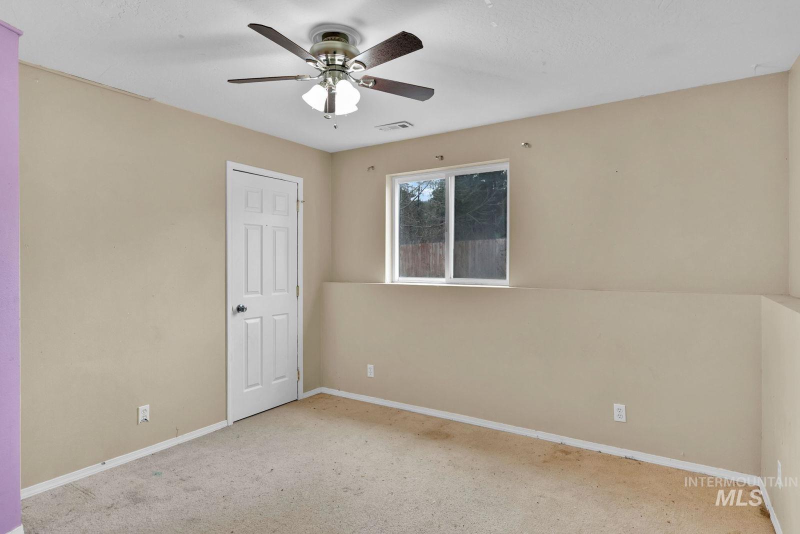 8561 Nebraska Street Rathdrum, ID 83858 - Photo 31 of 50 Carpeted spare room featuring a ceiling fan and baseboards