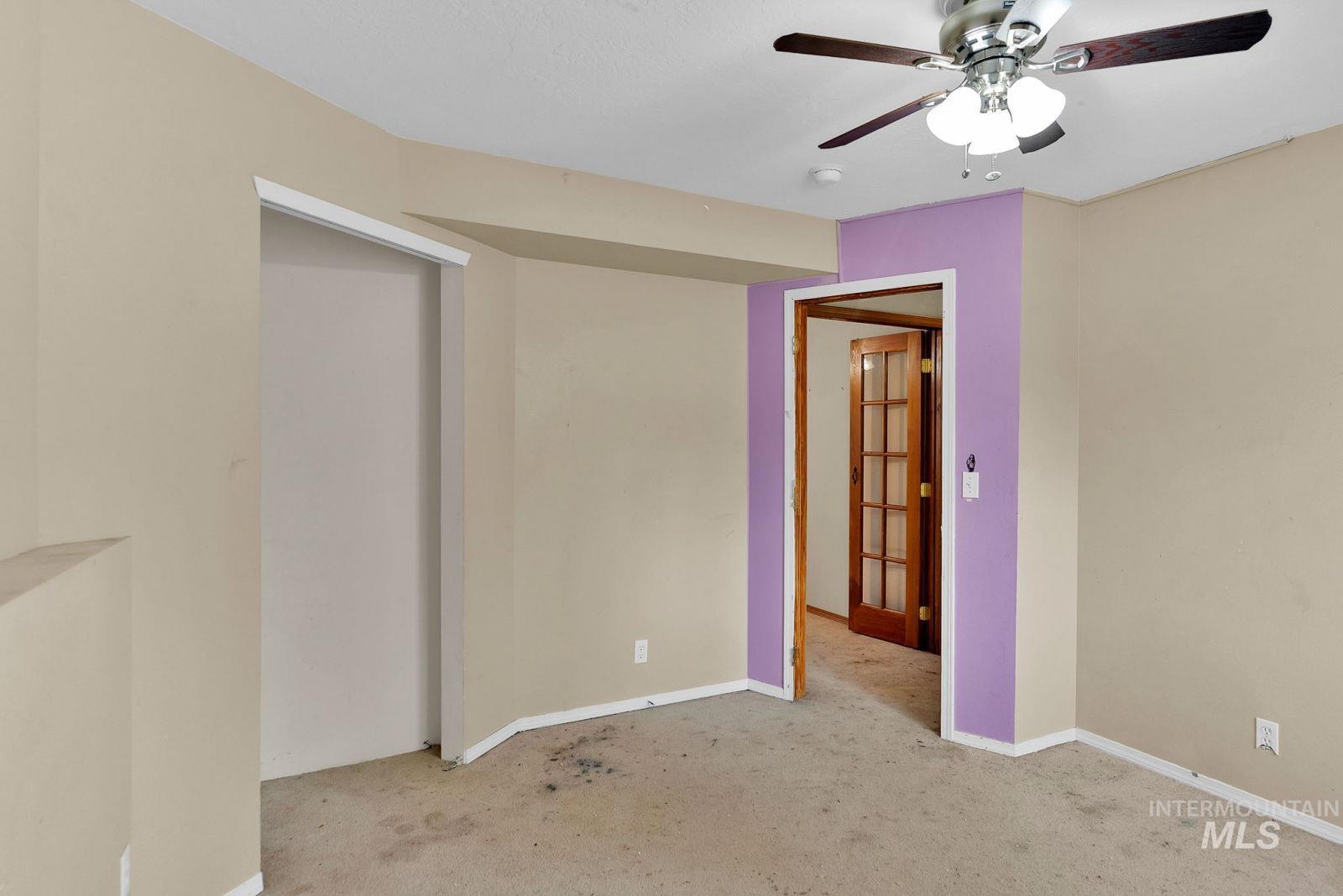 8561 Nebraska Street Rathdrum, ID 83858 - Photo 32 of 50 Unfurnished bedroom featuring light carpet and a ceiling fan