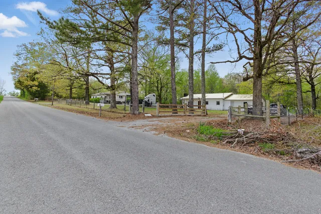 a view of the house with a yard
