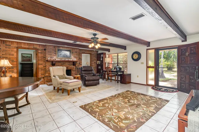 a living room with furniture and a rug