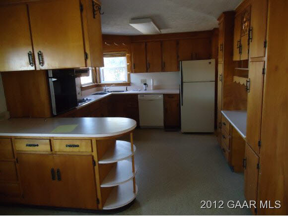 7289 Cross Keys Road Mount Crawford, VA 22841 - Photo 8 of 13 a kitchen with stainless steel appliances granite countertop a refrigerator a stove and a sink