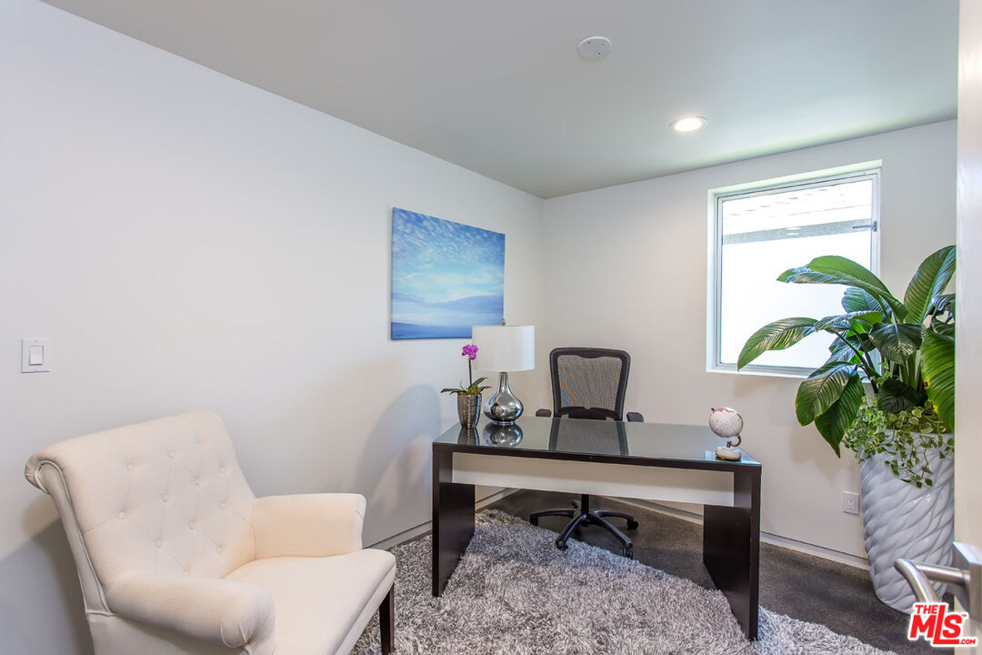 615 6th Avenue, Unit 1/2 Venice, CA 90291 - Photo 18 of 44 a living room with furniture and a potted plant