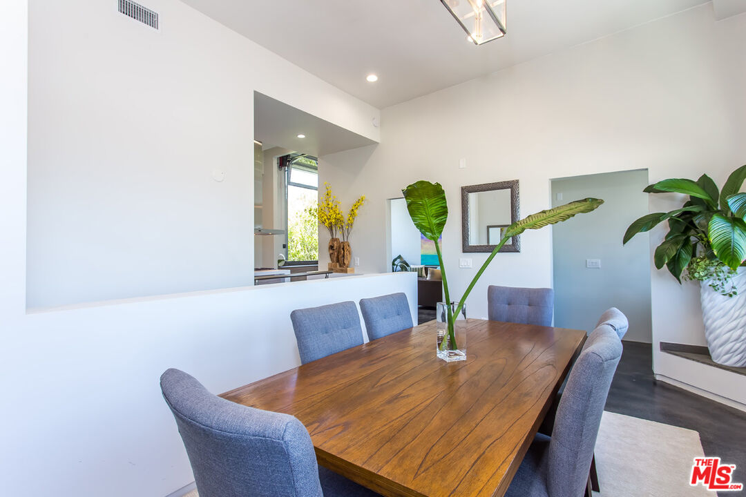 615 6th Avenue, Unit 1/2 Venice, CA 90291 - Photo 20 of 44 a view of a dining room with furniture and a potted plant