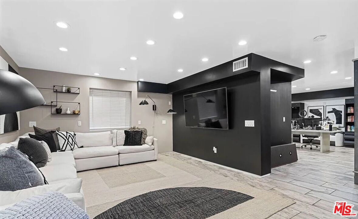 615 6th Avenue, Unit 1/2 Venice, CA 90291 - Photo 27 of 44 a living room with furniture and a rug