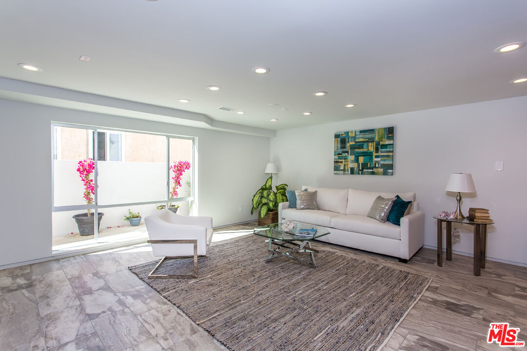 615 6th Avenue, Unit 1/2 Venice, CA 90291 - Photo 29 of 44 a living room with furniture and a wooden floor
