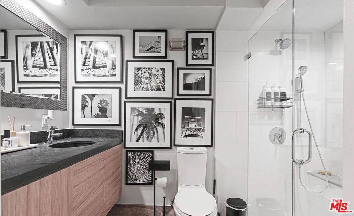 615 6th Avenue, Unit 1/2 Venice, CA 90291 - Photo 30 of 44 a bathroom with a sink and mirror