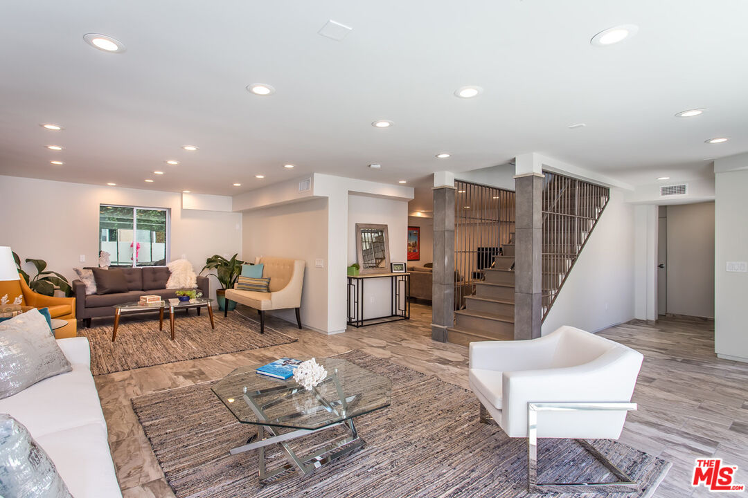 615 6th Avenue, Unit 1/2 Venice, CA 90291 - Photo 31 of 44 a living room with furniture kitchen view and a wooden floor