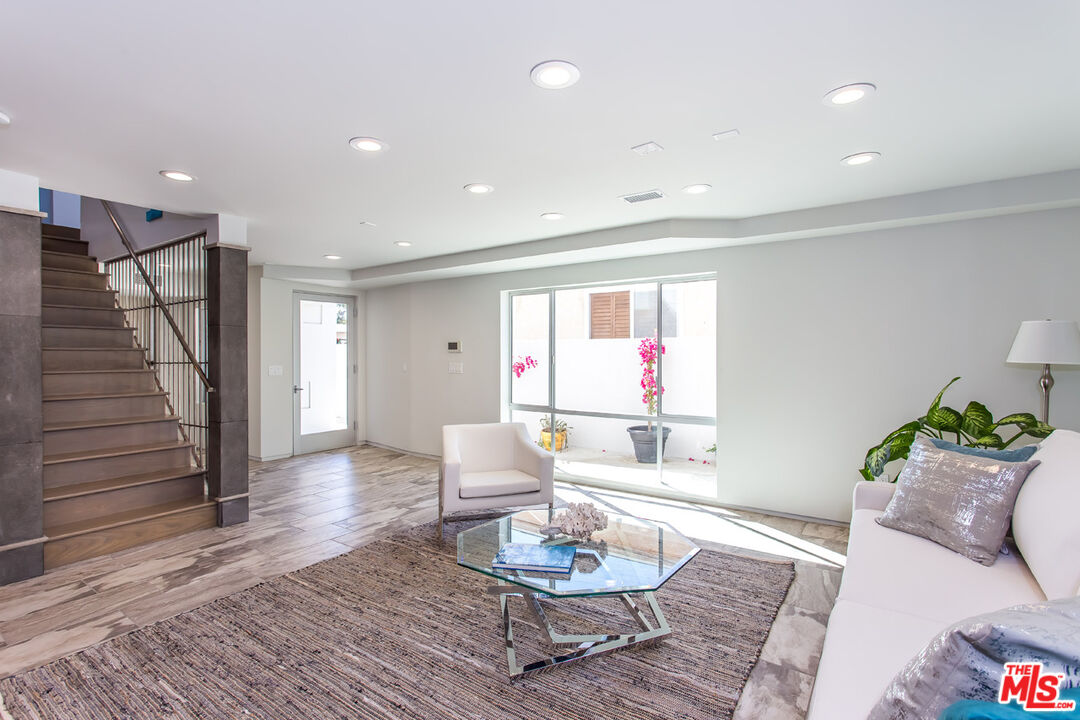 615 6th Avenue, Unit 1/2 Venice, CA 90291 - Photo 32 of 44 a living room with furniture and wooden floor