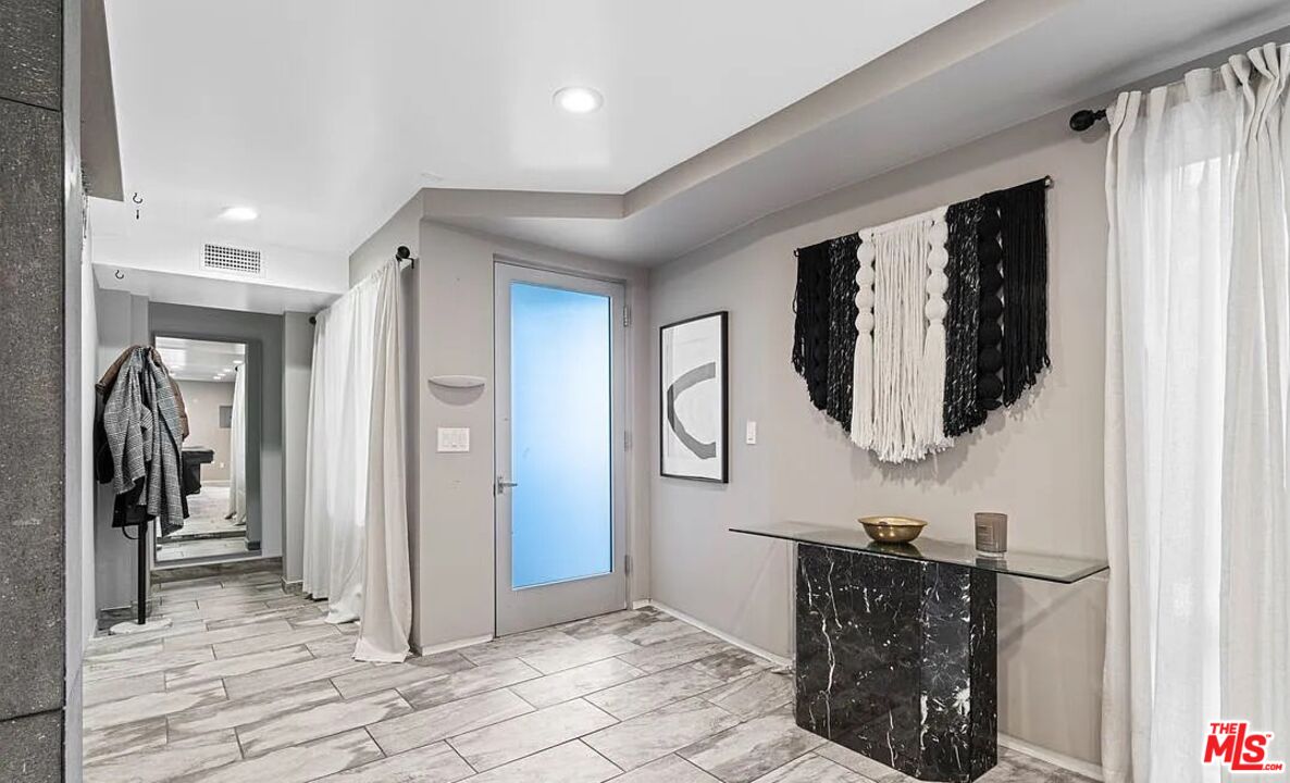 615 6th Avenue, Unit 1/2 Venice, CA 90291 - Photo 33 of 44 a view of a hallway with wooden floor and staircase