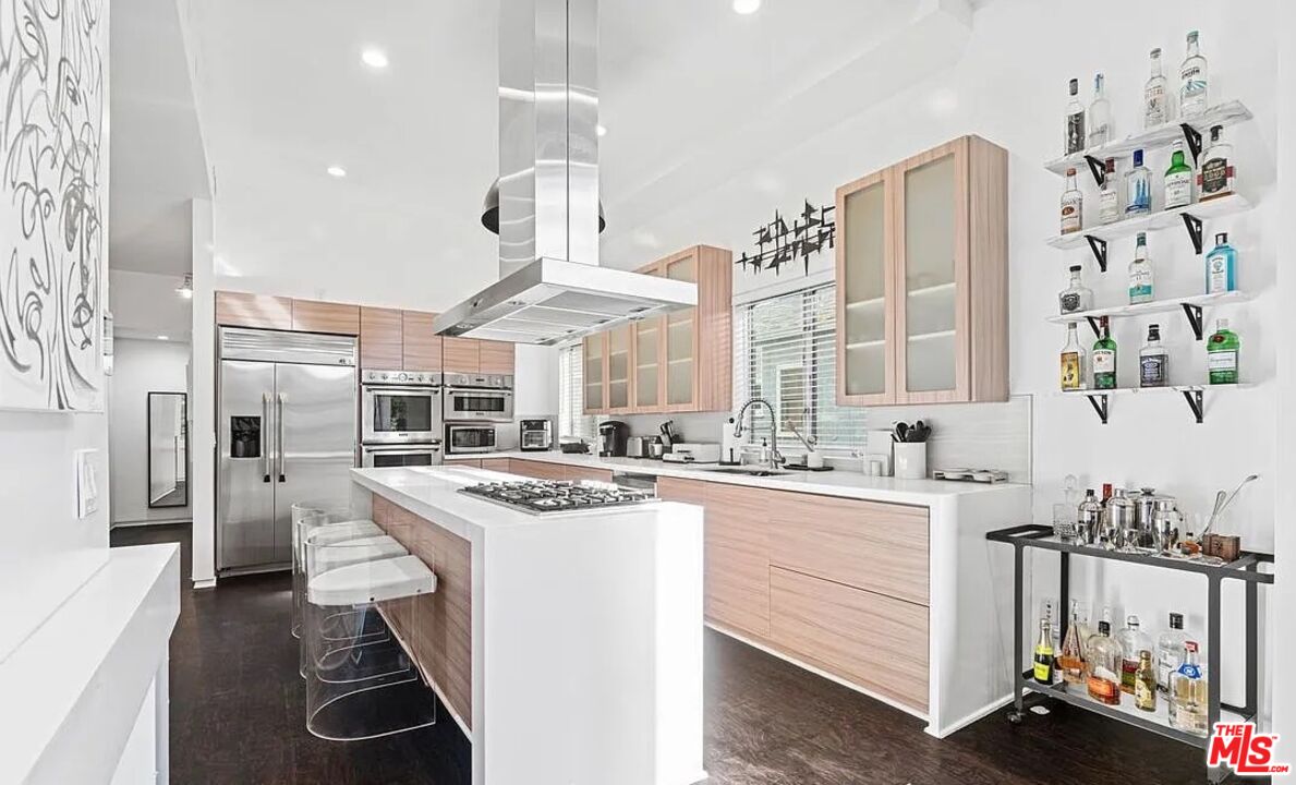 615 6th Avenue, Unit 1/2 Venice, CA 90291 - Photo 5 of 44 a kitchen with stainless steel appliances granite countertop a stove a sink dishwasher and a refrigerator with wooden floor