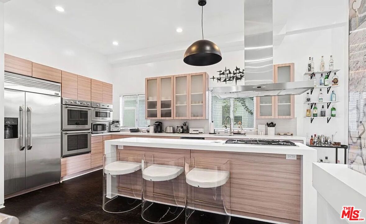 615 6th Avenue, Unit 1/2 Venice, CA 90291 - Photo 6 of 44 a large kitchen with a center island and stainless steel appliances