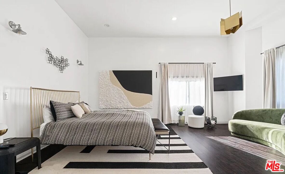 615 6th Avenue, Unit 1/2 Venice, CA 90291 - Photo 9 of 44 a bedroom with a bed and wooden floor