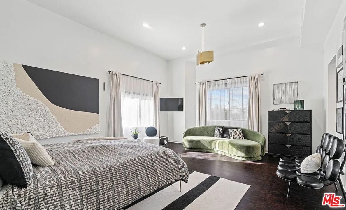 615 6th Avenue, Unit 1/2 Venice, CA 90291 - Photo 10 of 44 a bedroom with a bed and wooden floor