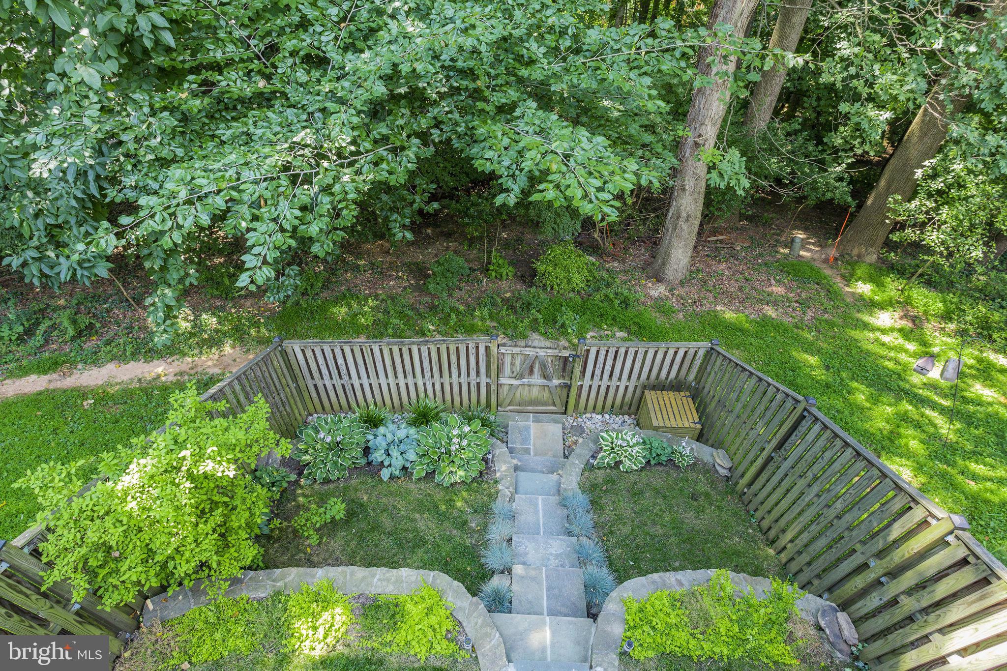 9129 Saffron Lane Silver Spring, MD 20901 - Photo 14 of 38 Deck view of fully fenced yard backing to trees