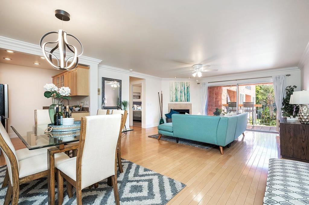 3688 1st Avenue, Unit 15 San Diego, CA 92103 - Photo 1 of 35 a living room with furniture a dining table and a chandelier