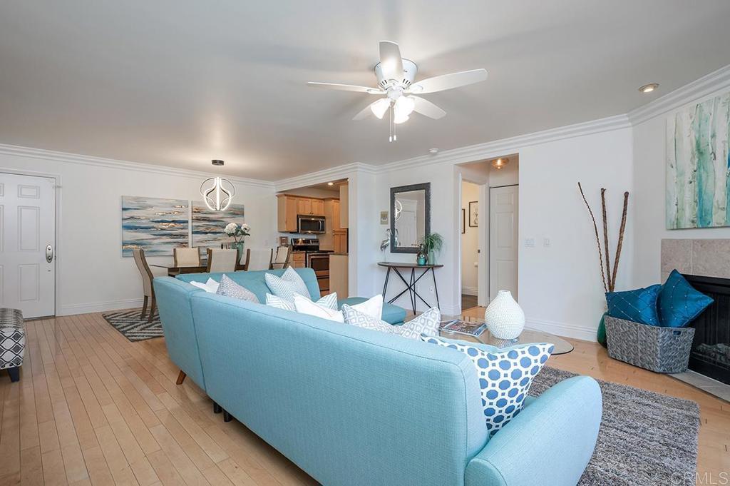 3688 1st Avenue, Unit 15 San Diego, CA 92103 - Photo 11 of 35 a living room with furniture and a chandelier