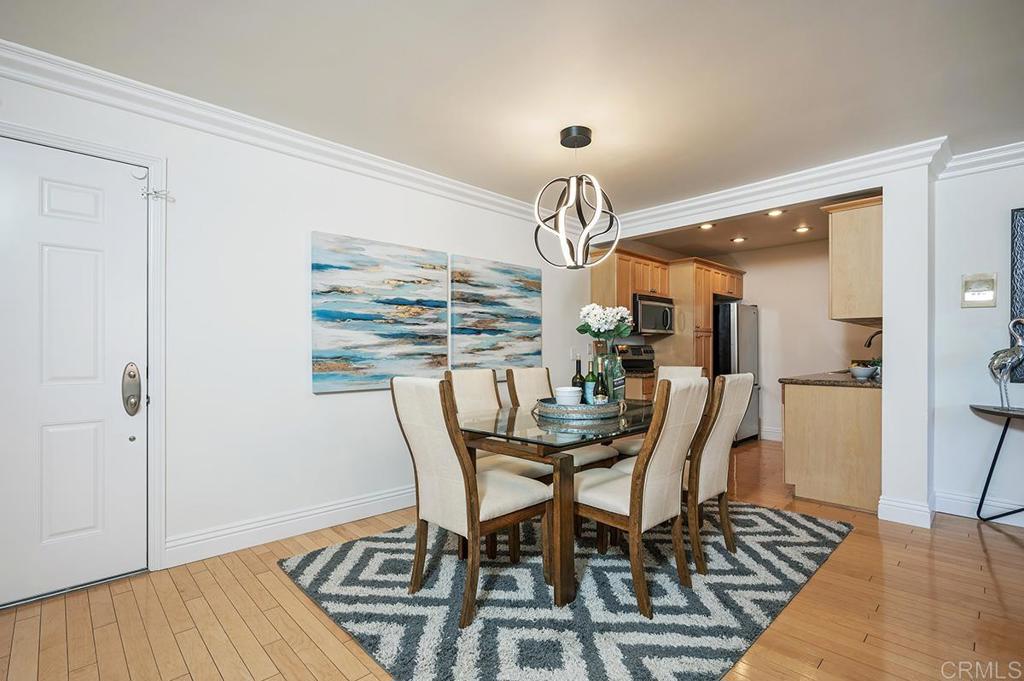 3688 1st Avenue, Unit 15 San Diego, CA 92103 - Photo 2 of 35 a view of a dining room with furniture