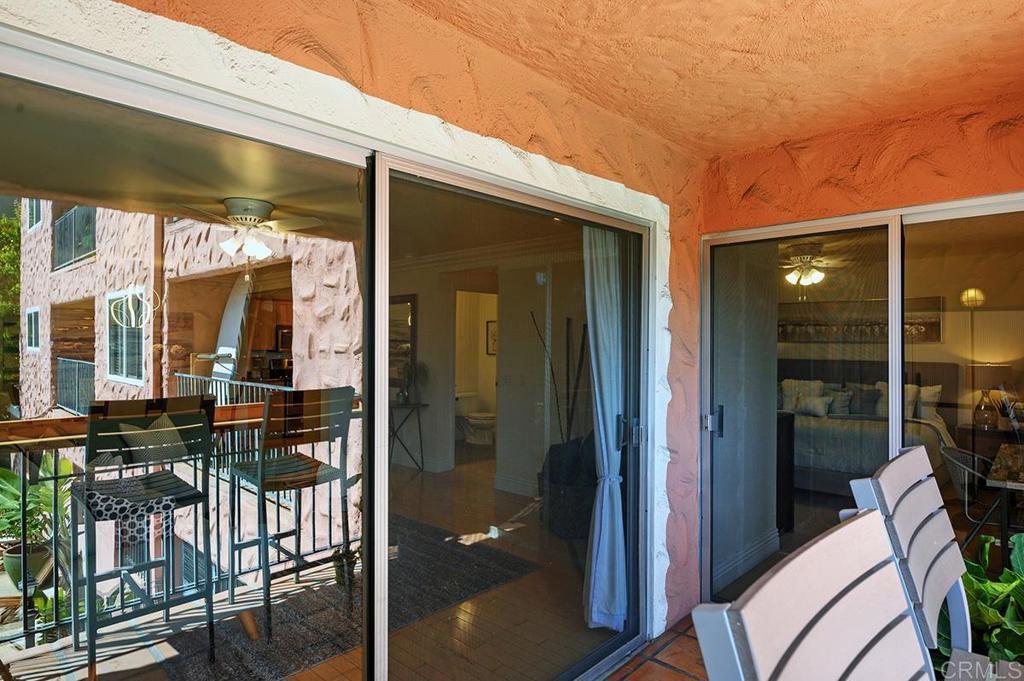 3688 1st Avenue, Unit 15 San Diego, CA 92103 - Photo 23 of 35 a view of a porch with chairs and floor to ceiling window