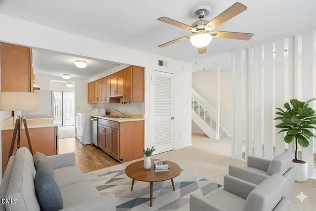 a view of a kitchen with a sink and a stove top oven