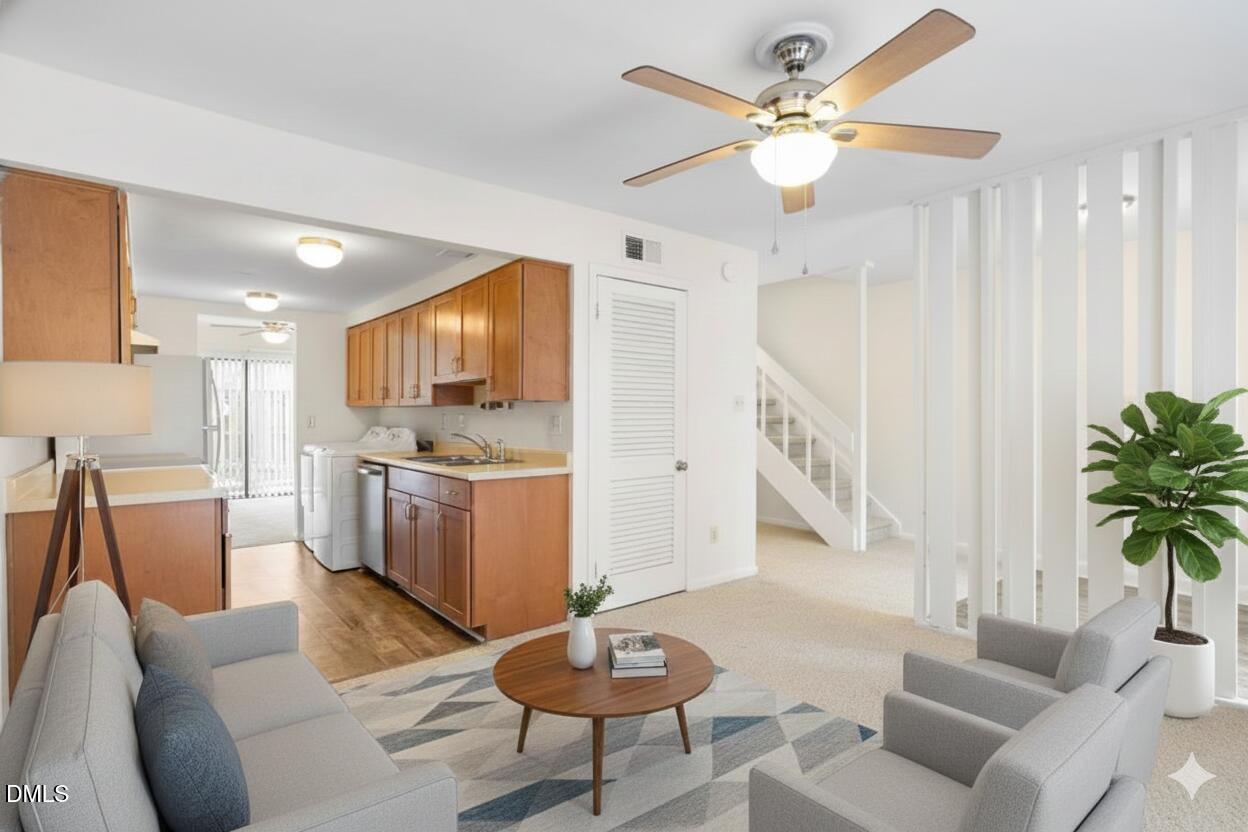 1748 Quail Ridge Road Raleigh, NC 27609 - Photo 11 of 36 a living room with furniture and a dining table with kitchen view